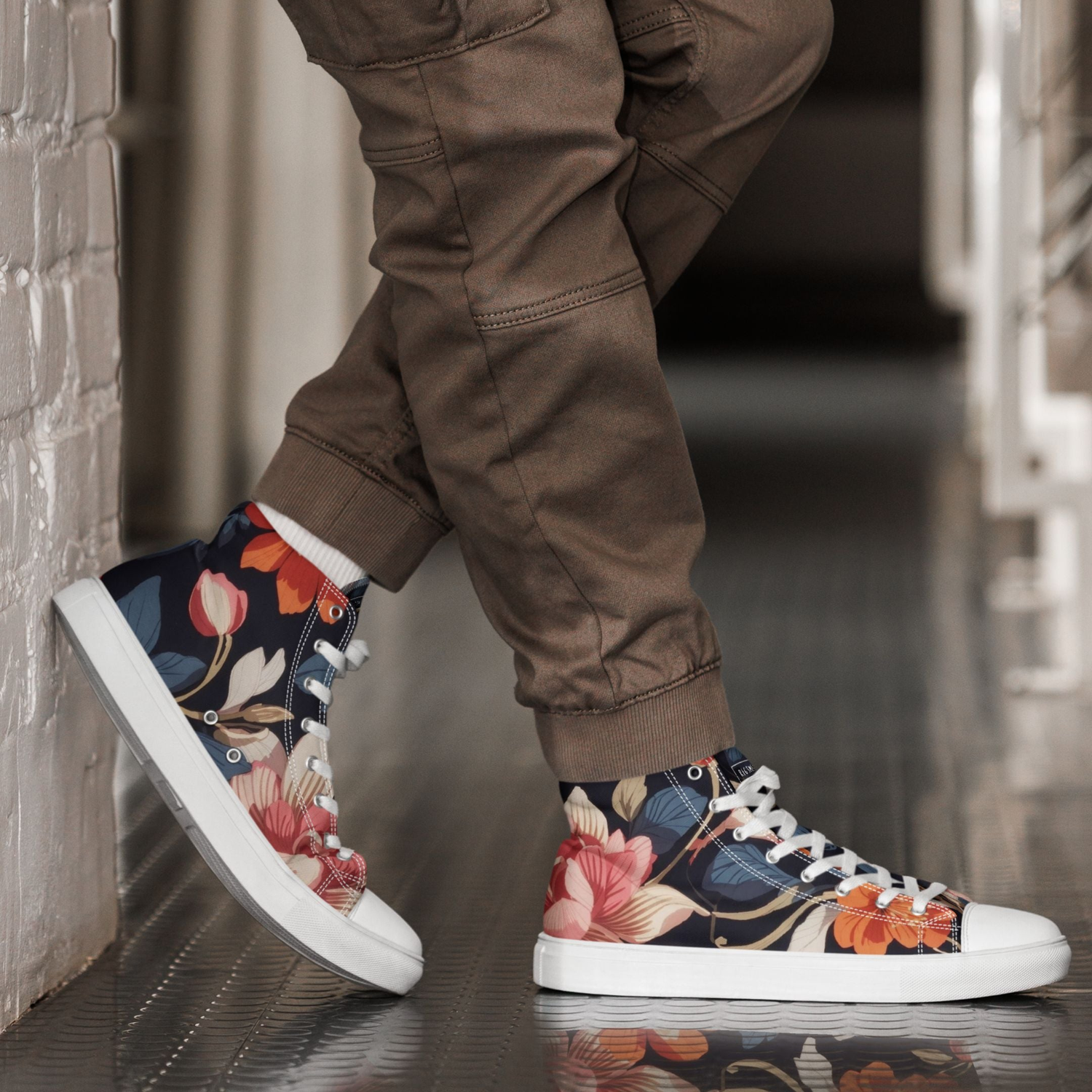 A pair of floral high-top canvas kicks, featuring vibrant flower patterns for a stylish, standout look. These sneakers offer comfort and unique flair, ideal for those seeking trendy, expressive footwear to elevate any casual outfit with a pop of color.