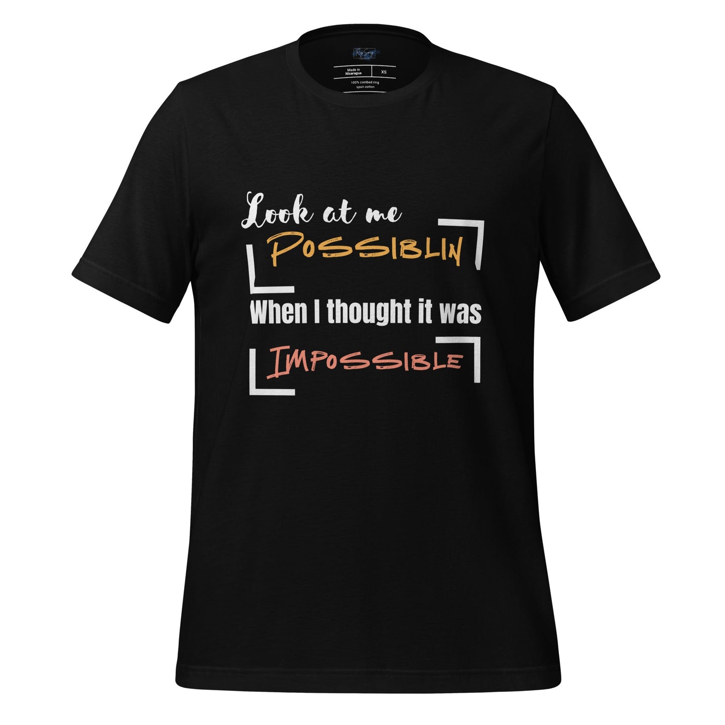 T-shirt featuring the motivational phrase 'Look at Me Possiblin When I Thought It Was Impossible' in bold orange and coral text.