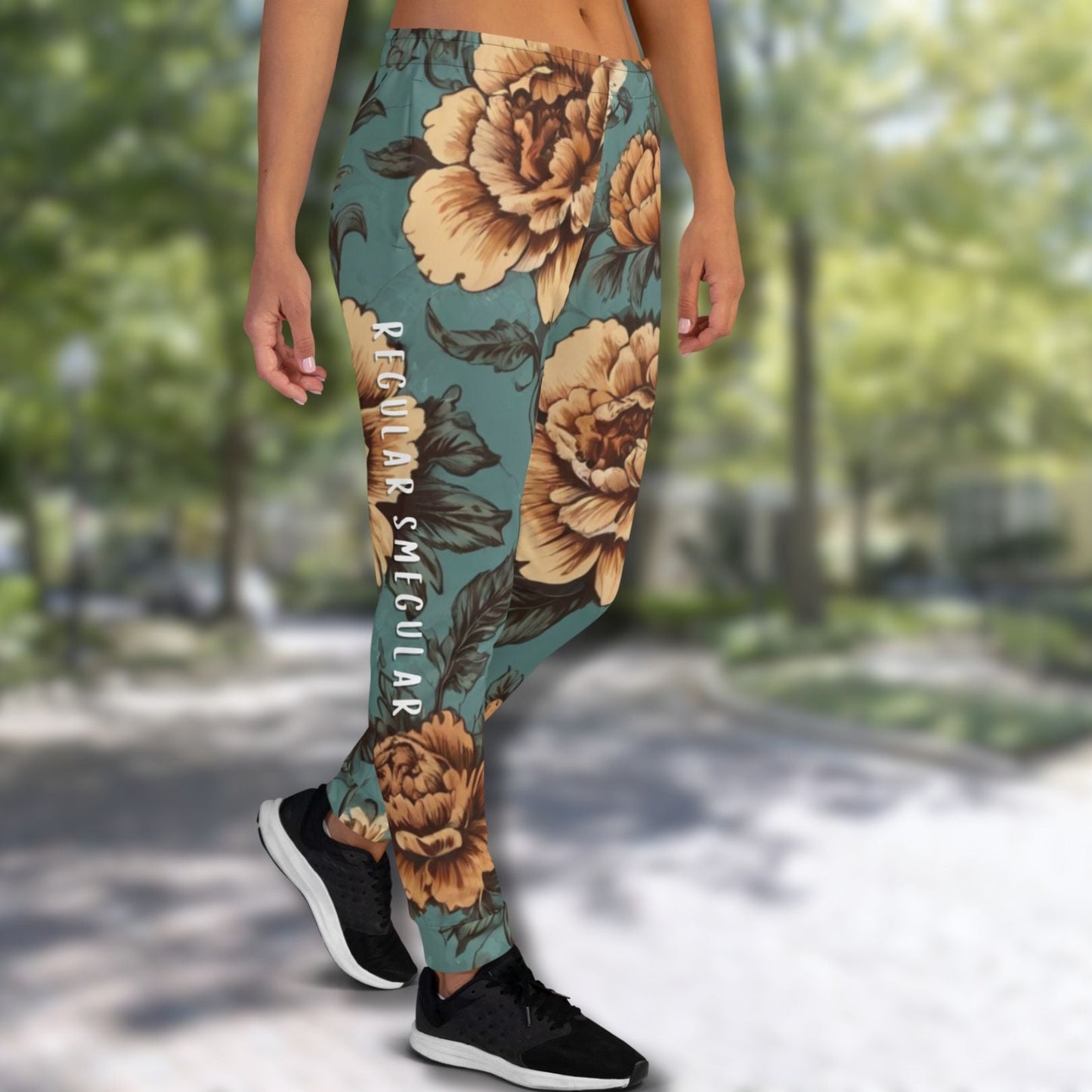 Teal vintage floral joggers with Regular Smegular text printed down the right leg