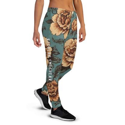 Teal vintage floral joggers with Regular Smegular text printed down the right leg